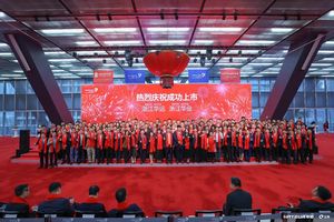 A group of people posing for a photo in a large hall