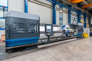 An angular view of a machining center with its doors wide open
