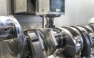 A section of a crankshaft being machined, photographed from an angle