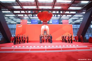 A group of people performing a bell ringing ceremony
