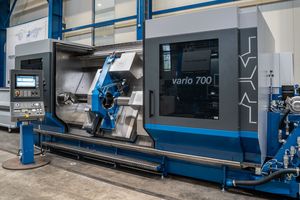 An angular view of a machining center with its doors wide open