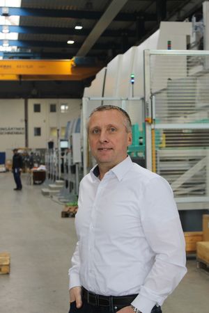 A man standing with his hands in his pockets