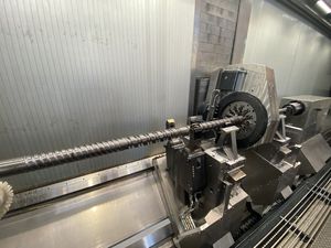An injection molding screw being machined